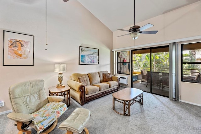 living room with high vaulted ceiling, ceiling fan, and carpet