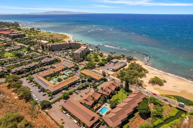 birds eye view of property featuring a water view and a view of the beach