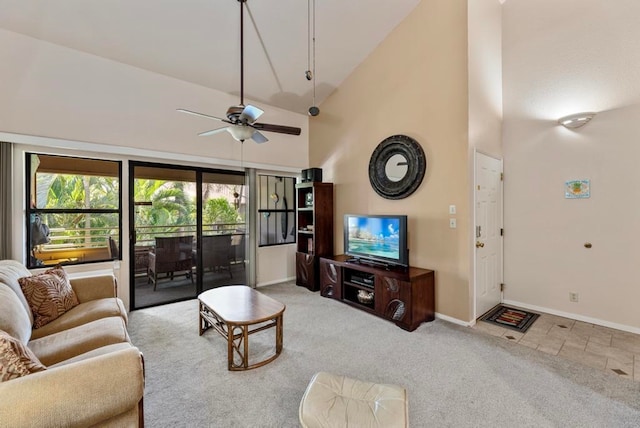 living room featuring ceiling fan, light colored carpet, and high vaulted ceiling