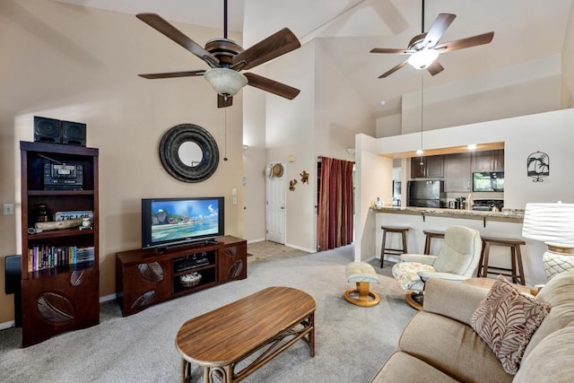 679 S Kihei Rd Unit D205, Kihei, HI 96753 - living room featuring baseboards, a ceiling fan, light carpet, and high vaulted ceiling