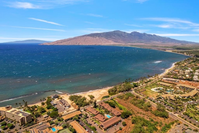 aerial view featuring a water and mountain view