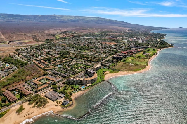 drone / aerial view featuring a water and mountain view