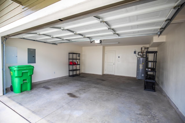 garage featuring water heater, electric panel, and a garage door opener