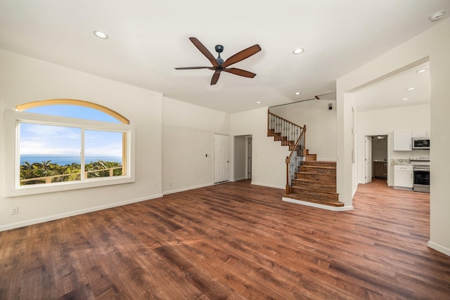 unfurnished living room with ceiling fan and hardwood / wood-style floors