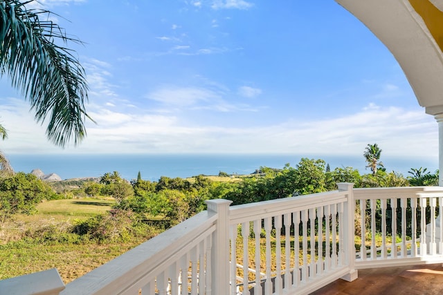 balcony featuring a water view