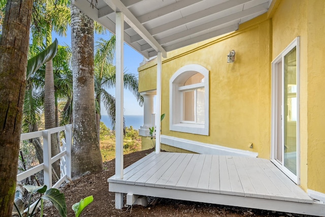 wooden terrace with a water view