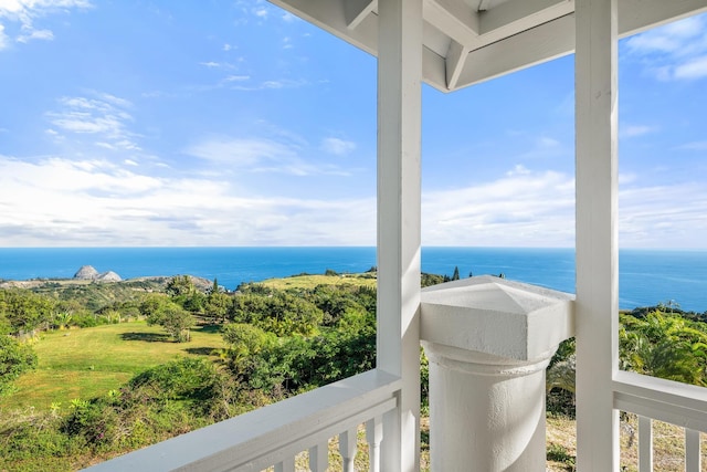 balcony featuring a water view