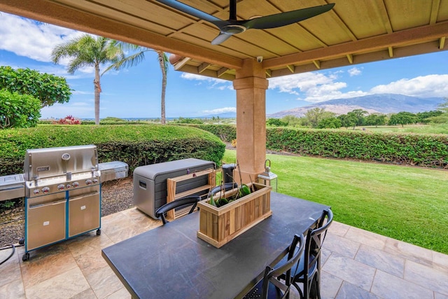 2335 Hihimanu St Unit 117, Kihei, HI 96753 - view of patio featuring grilling area, a ceiling fan, agricultural plots, and a mountain view