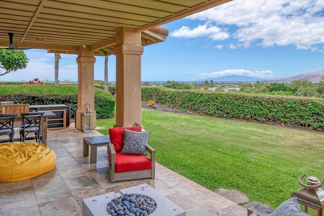 2335 Hihimanu St Unit 117, Kihei, HI 96753 - view of patio / terrace with a fire pit, a mountain view, and agricultural area