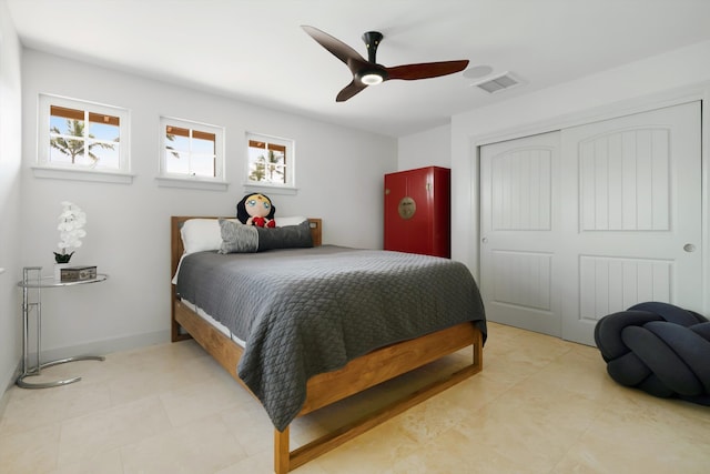 2335 Hihimanu St Unit 117, Kihei, HI 96753 - bedroom with multiple windows, a closet, ceiling fan, and light tile patterned floors
