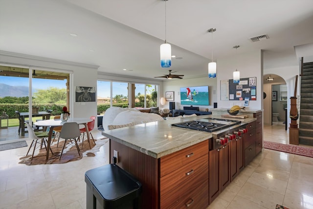 2335 Hihimanu St Unit 117, Kihei, HI 96753 - kitchen with stainless steel gas stovetop, plenty of natural light, ceiling fan, open floor plan, and recessed lighting