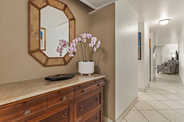 hall featuring light tile flooring