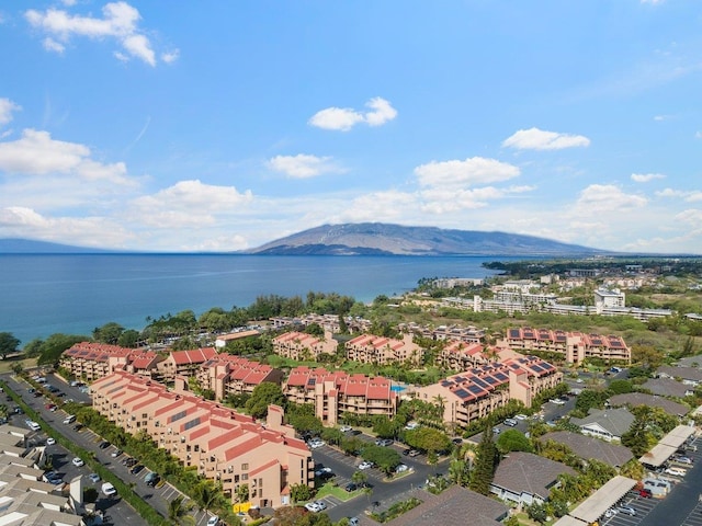 aerial view featuring a water and mountain view