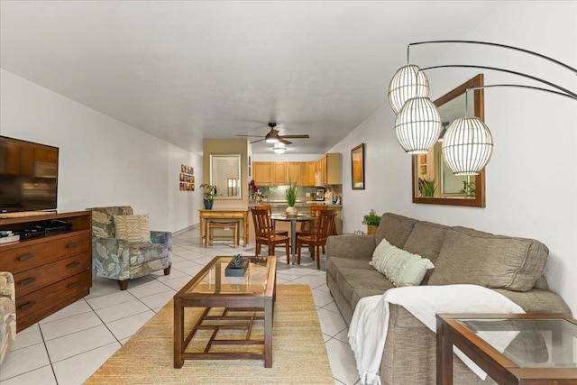 living room featuring ceiling fan and light tile flooring