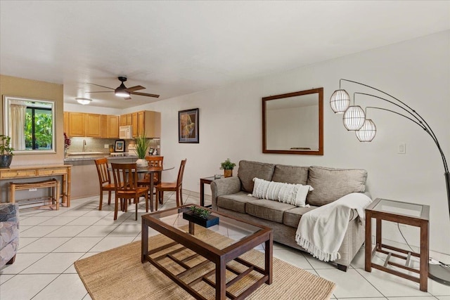 tiled living room featuring ceiling fan