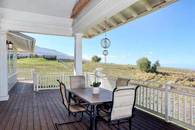 wooden terrace with a mountain view and a rural view