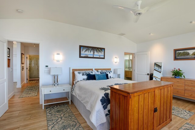 bedroom featuring ceiling fan, vaulted ceiling, and light wood-type flooring