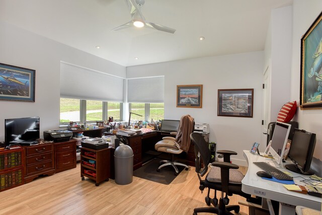 home office with ceiling fan and light hardwood / wood-style floors