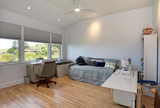 bedroom featuring ceiling fan, lofted ceiling, and light hardwood / wood-style floors