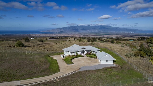 birds eye view of property with a mountain view