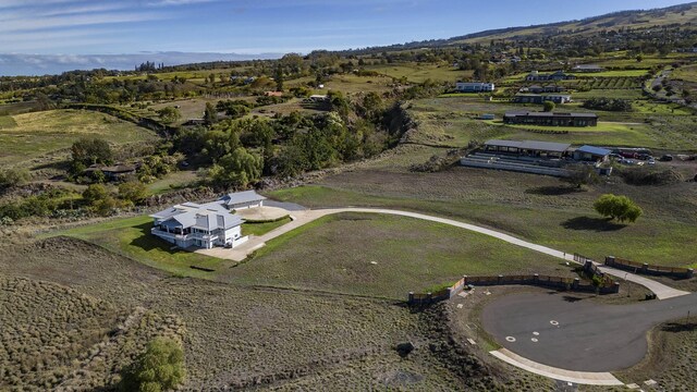 birds eye view of property featuring a rural view