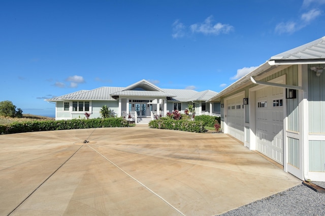 view of front of property featuring a porch and a garage