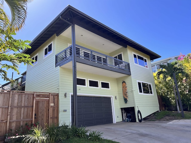 view of front facade with a balcony and a garage