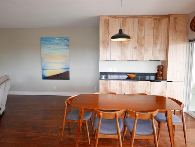 dining space with dark wood-type flooring