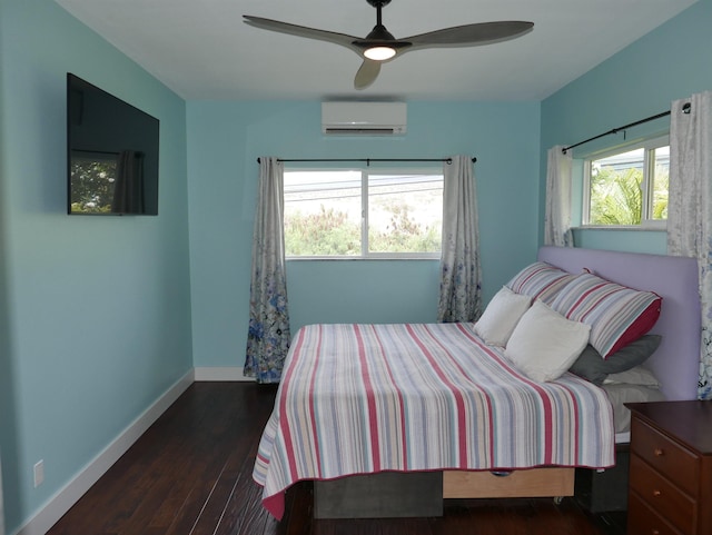 bedroom featuring ceiling fan, dark wood-type flooring, and a wall mounted air conditioner