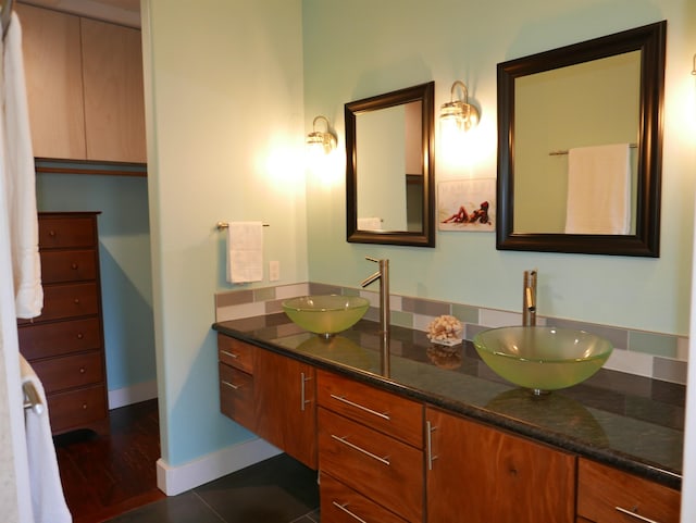 bathroom featuring tile patterned flooring and vanity