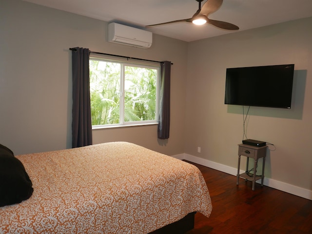 bedroom featuring ceiling fan, dark wood-type flooring, and a wall mounted AC