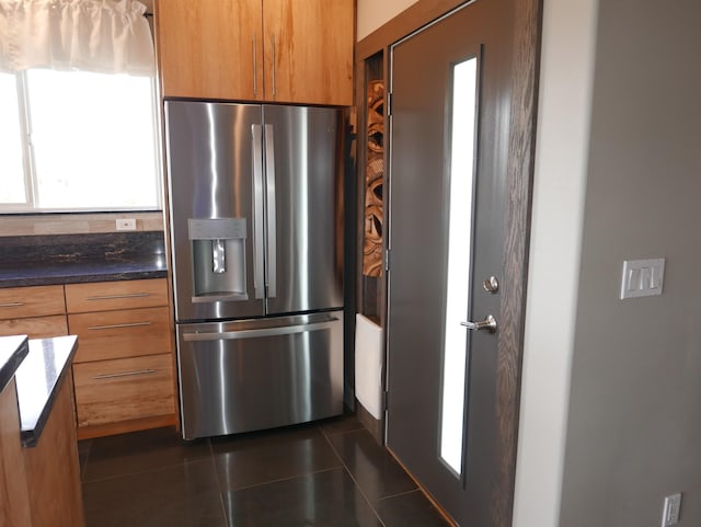 kitchen with stainless steel refrigerator with ice dispenser