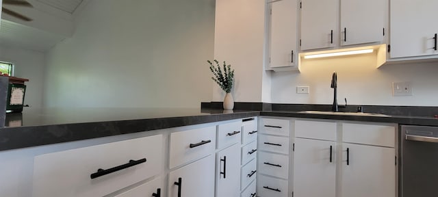 kitchen with white cabinetry, sink, and stainless steel dishwasher