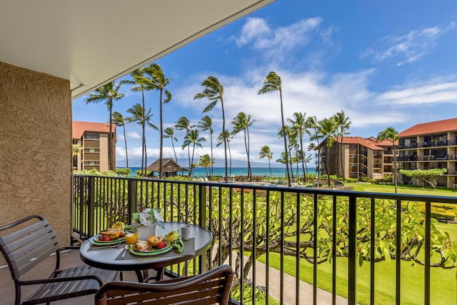 balcony featuring a water view