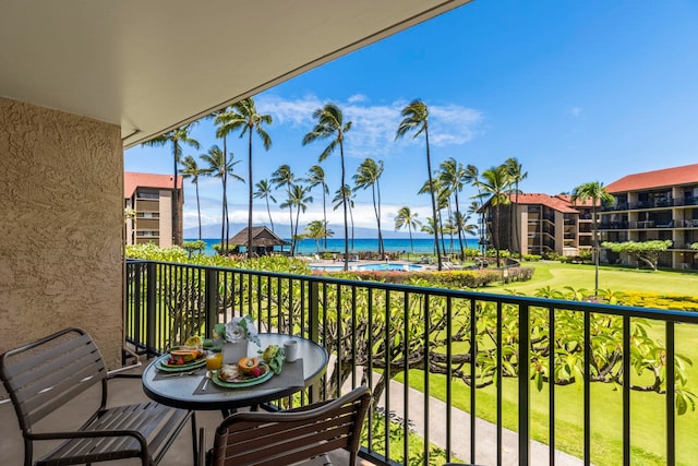 balcony featuring a water view