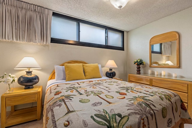 bedroom featuring carpet and a textured ceiling