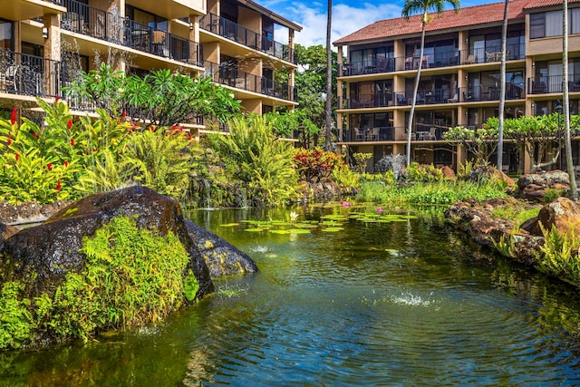 view of home's community with a water view