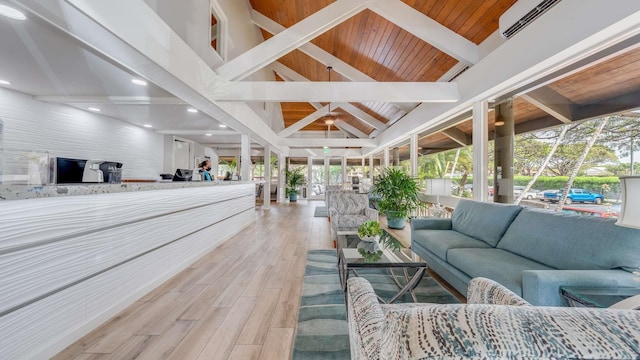 interior space with high vaulted ceiling, beam ceiling, wooden ceiling, and light wood-type flooring