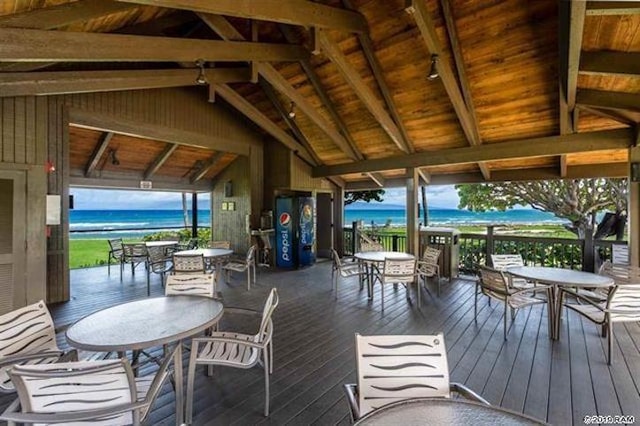 wooden deck featuring a water view and a gazebo