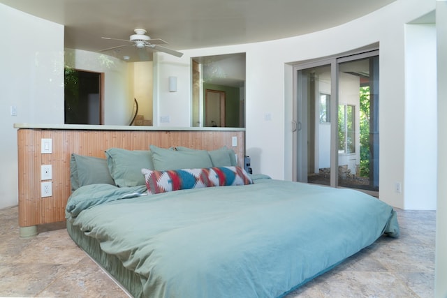 bedroom featuring ceiling fan and access to exterior