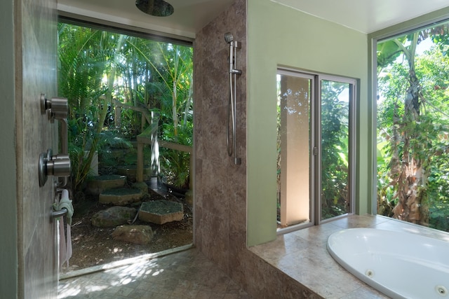 bathroom featuring tiled tub