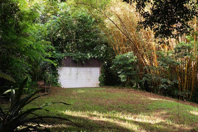 view of yard with a garage