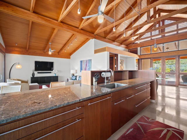 3100 Wailea Alanui Dr Unit 12, Kihei, HI 96753 - kitchen with a sink, wooden ceiling with exposed beams, ceiling fan, open floor plan, and dark stone counters