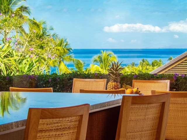 3100 Wailea Alanui Dr Unit 12, Kihei, HI 96753 - view of swimming pool featuring outdoor dining space and a water view