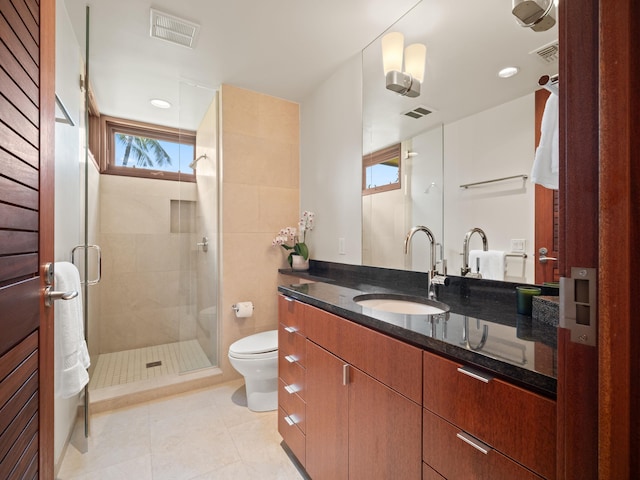 3100 Wailea Alanui Dr Unit 12, Kihei, HI 96753 - bathroom featuring toilet, a shower stall, tile patterned floors, and vanity