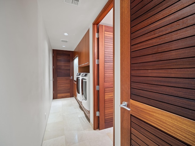 3100 Wailea Alanui Dr Unit 12, Kihei, HI 96753 - hallway with washing machine and clothes dryer, recessed lighting, baseboards, and light tile patterned floors