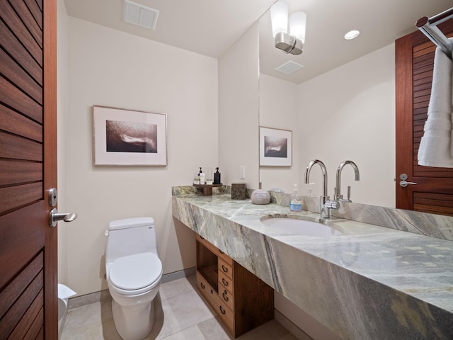 3100 Wailea Alanui Dr Unit 12, Kihei, HI 96753 - bathroom with toilet, vanity, baseboards, tile patterned flooring, and recessed lighting