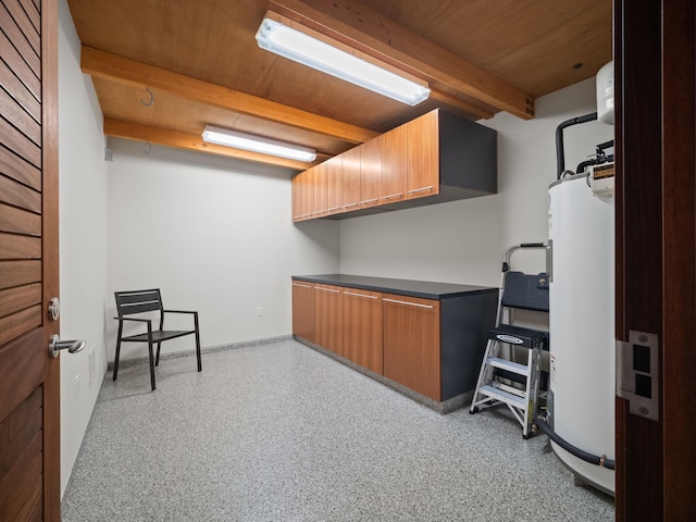 3100 Wailea Alanui Dr Unit 12, Kihei, HI 96753 - miscellaneous room with wooden ceiling with exposed beams, gas water heater, dark speckled floor, and baseboards