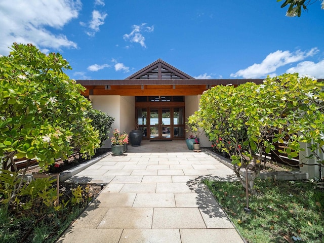 3100 Wailea Alanui Dr Unit 12, Kihei, HI 96753 - view of exterior entry featuring french doors and stucco siding