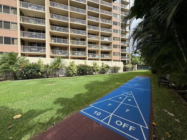 surrounding community featuring a lawn